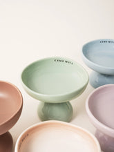 close-up-different-color-kamamuta-mushroom-bowls-placed-on-floor